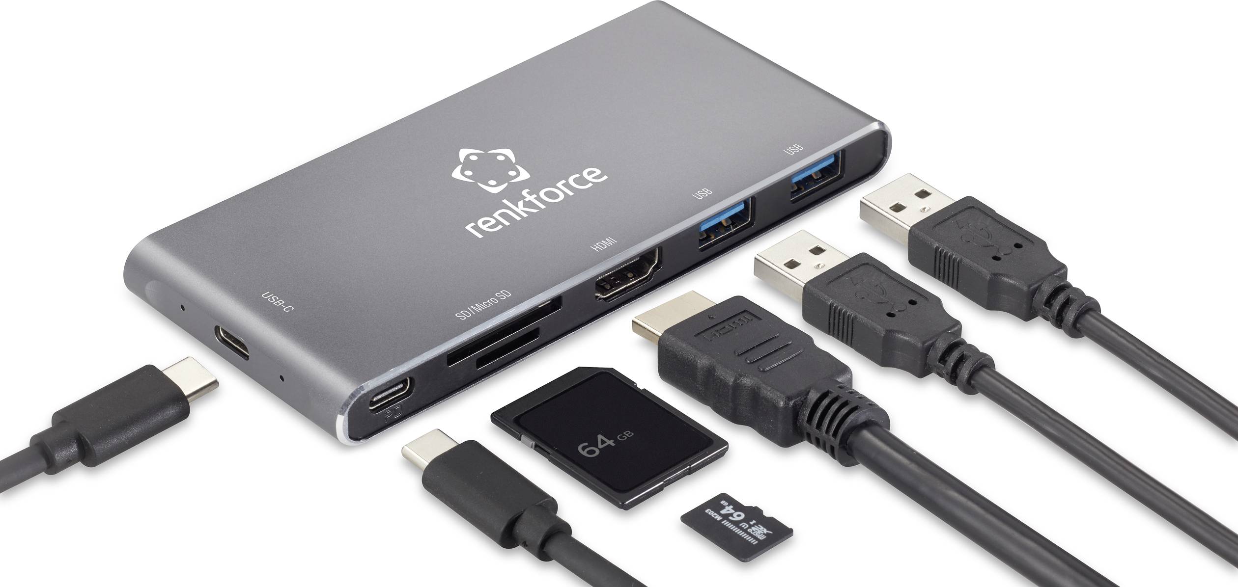 Stříbrný USB hub s několika porty, obklopený různými kabely a paměťovými kartami.