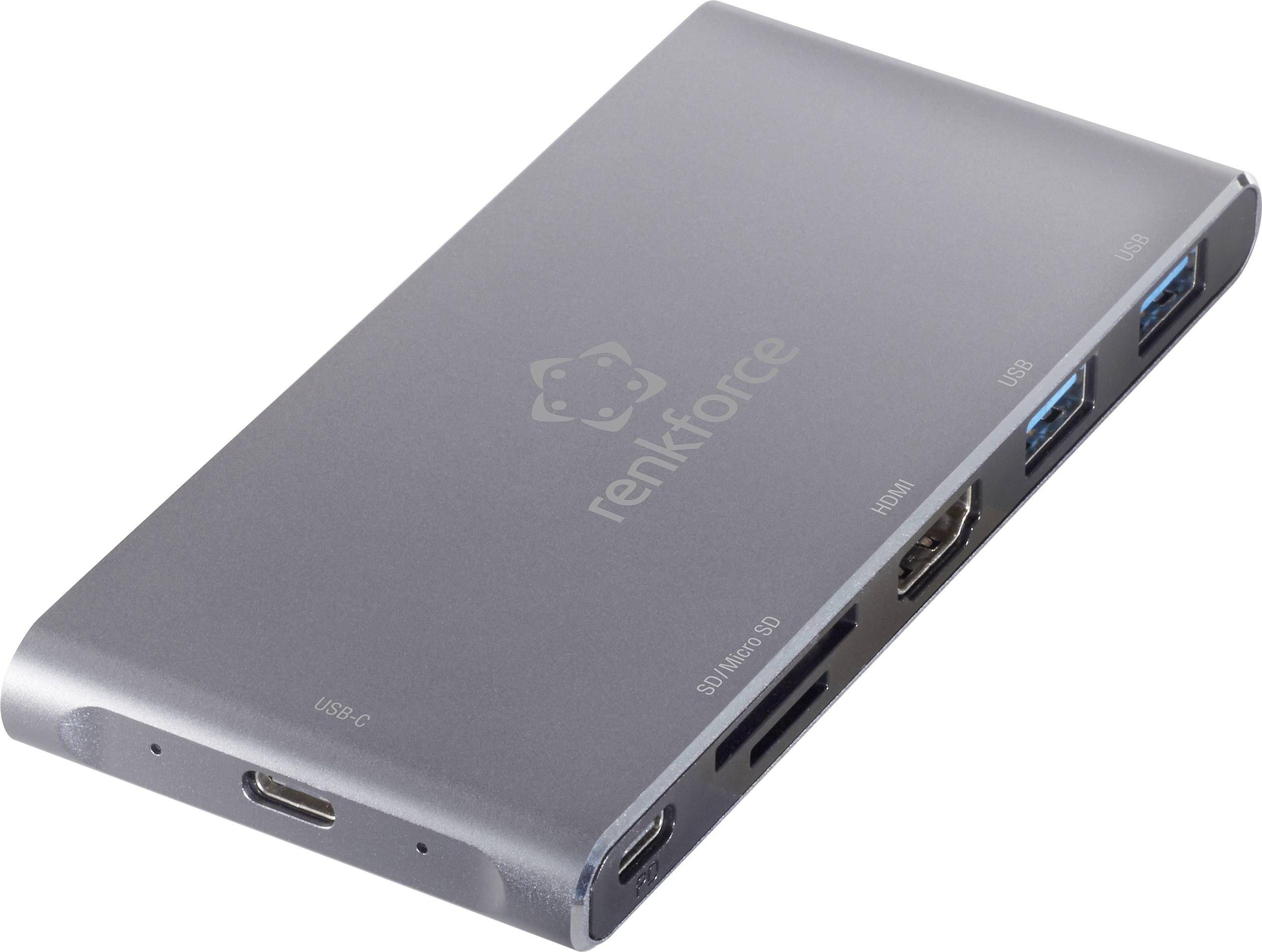 Stříbrný USB-C hub s několika porty pro HDMI, USB, SD karty a micro-SD karty.