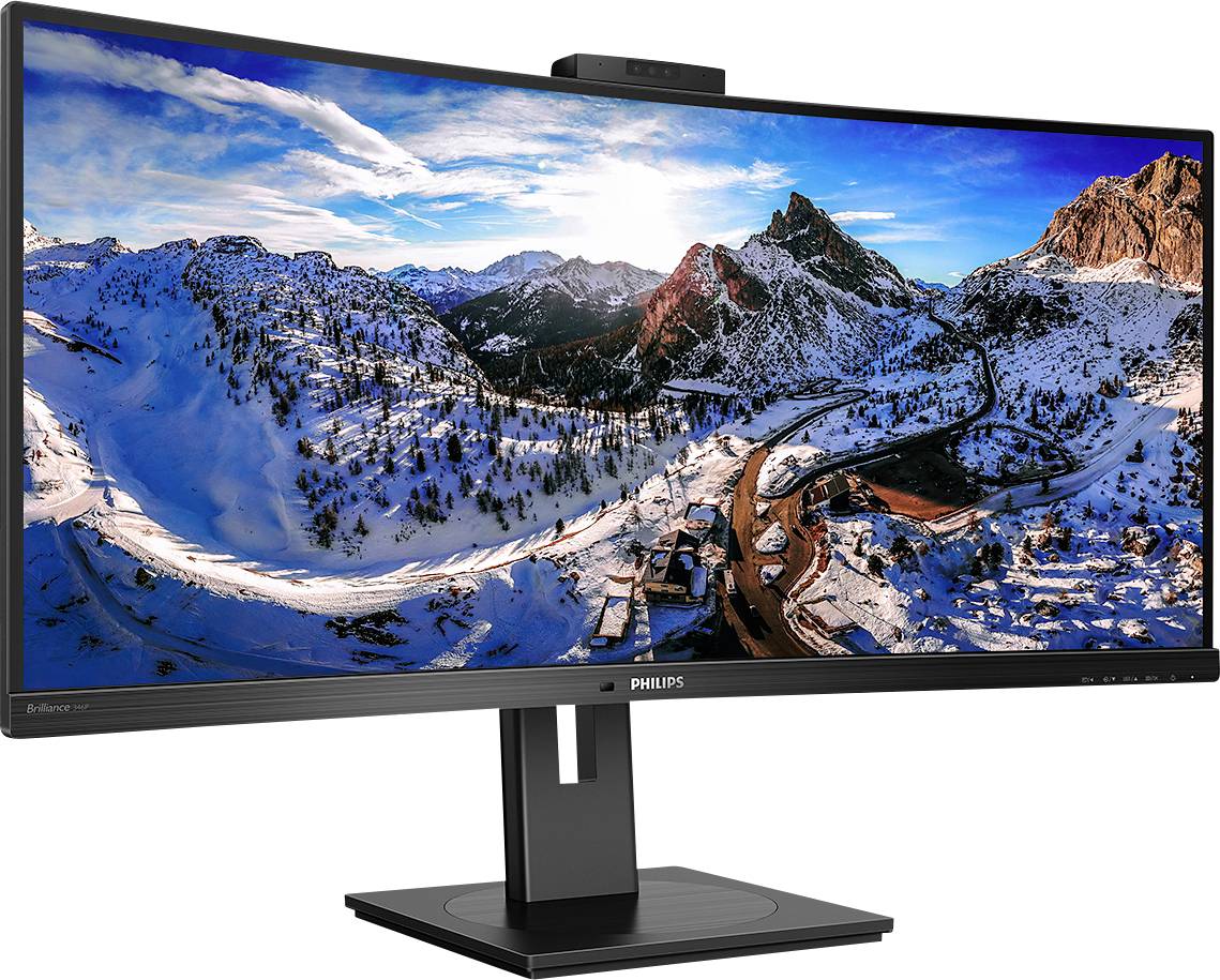 Široký zakřivený monitor s panoramatem zasněžených hor na obrazovce. Ideální pro pohlcující práci nebo hraní her.