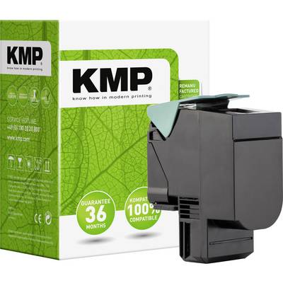Černý plastový kryt tiskové kazety umístěný před krabičkou s motivem zeleného listu. Na obalu je text "KMP" a "100% kompatibilní".