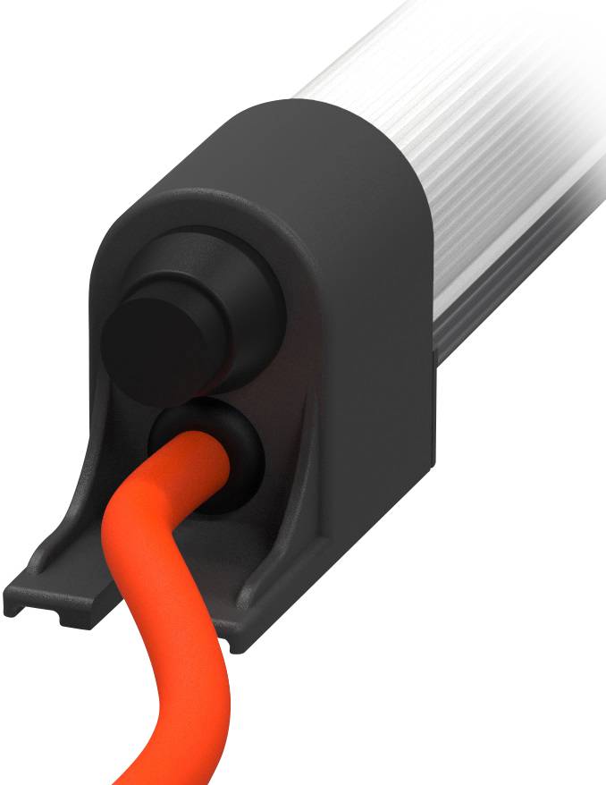 Černé zařízení s červeným kabelem, který je připojen zespodu. Kabel je pružný a zařízení působí průmyslovým designem.