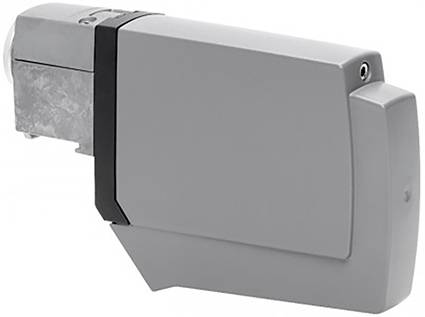Obdélníkové šedé zařízení s kovovým stříbrným dílem a menším konektorem na horní straně.