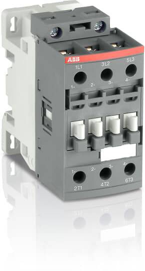 Šedobílý stykač Siemens, model ABB, s několika připojovacími svorkami, umístěný na reflexní ploše.