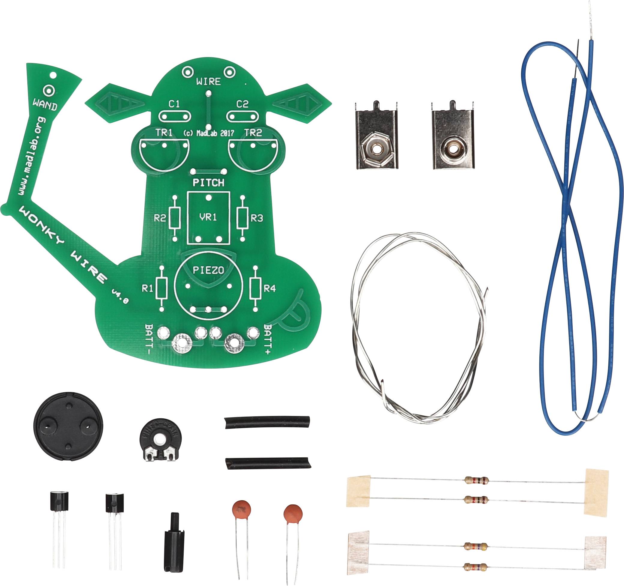 Stavebnice pro elektronický theremin. Obsahuje desku plošných spojů, elektronické komponenty a kabely.