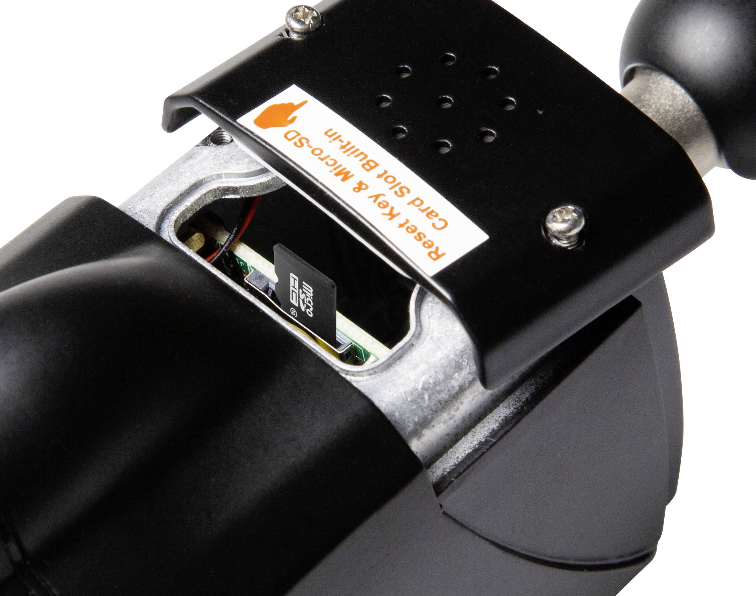 Černé zařízení s otevřeným krytem, které zobrazuje vloženou microSD kartu. Nahoře je nálepka s nápisem 'Reset Key'.