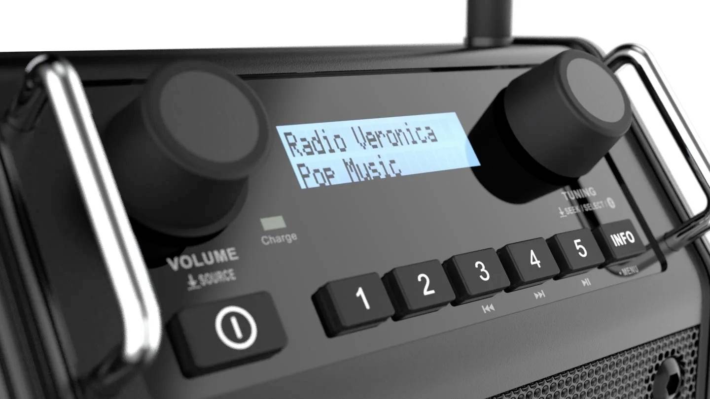Obrázek zobrazuje digitální rádio s displejem. Na obrazovce je napsáno 'Radio Veronica' a 'Pop Music'. Jsou viditelné otočné knoflíky a tlačítka.