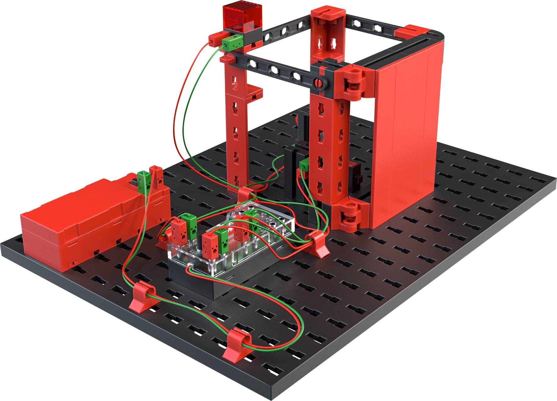 Červeno-černá modelová konstrukční sestava na perforované desce, osazená vodiči a elektronickými komponenty, znázorňuje technické projektové uspořádání.