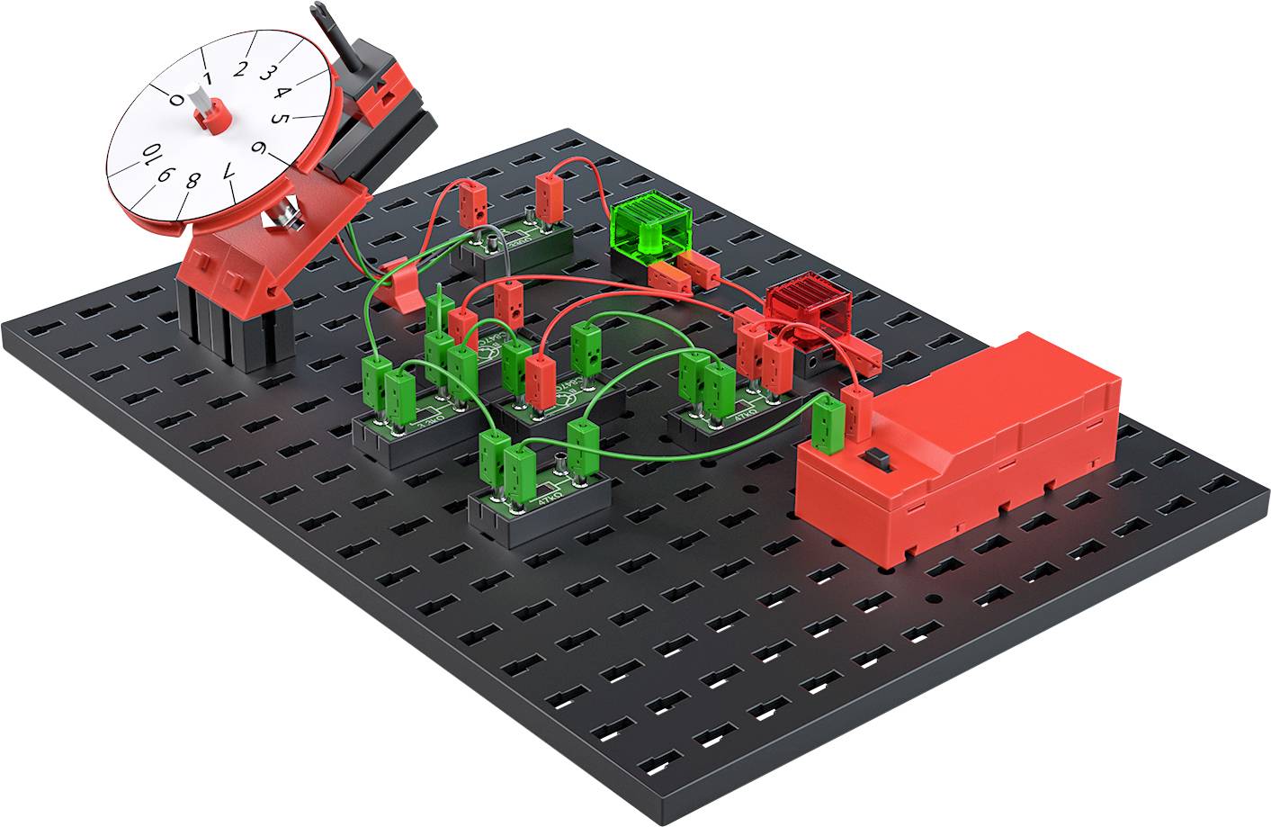 Elektronický výukový modul s obvody na černé desce. Červené a zelené komponenty znázorňují elektrické obvody a propojení.