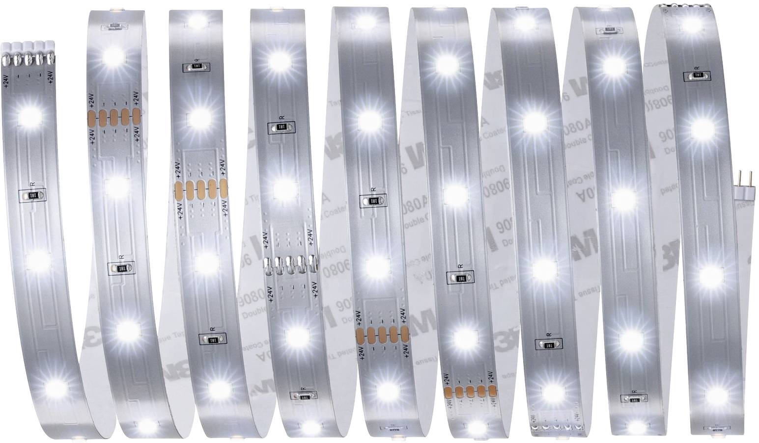 LED světelný pásek s několika světelnými body v pravidelných intervalech, svinutý a rozložený na neutrálním pozadí.