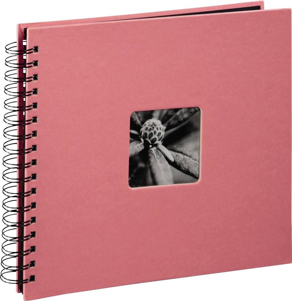 Červené spirálové album s černobílou fotografií rostlinného listu na obálce.