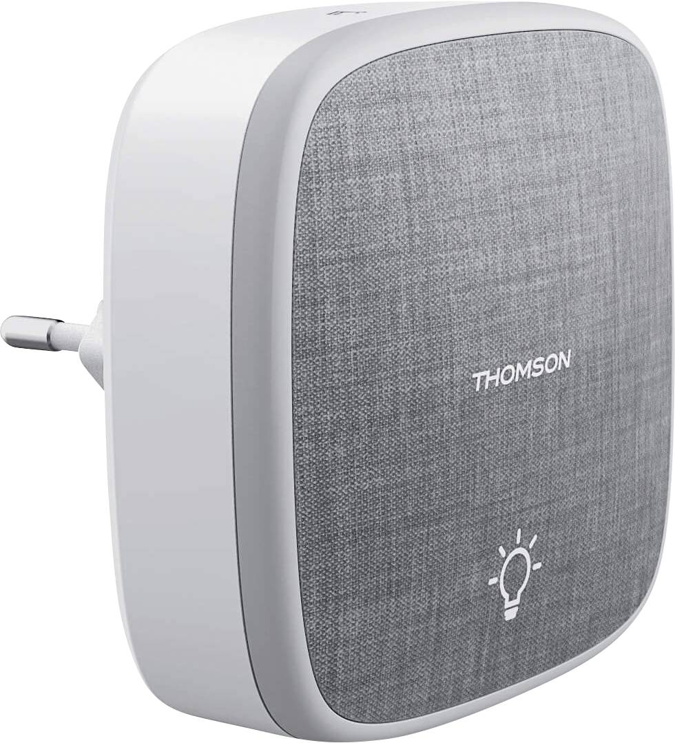 Elektronické zařízení pohledem z boku, bílé tělo s šedým látkový předním panelem a nápisem 'Thomson', LED symbol umístěný dole vpravo.