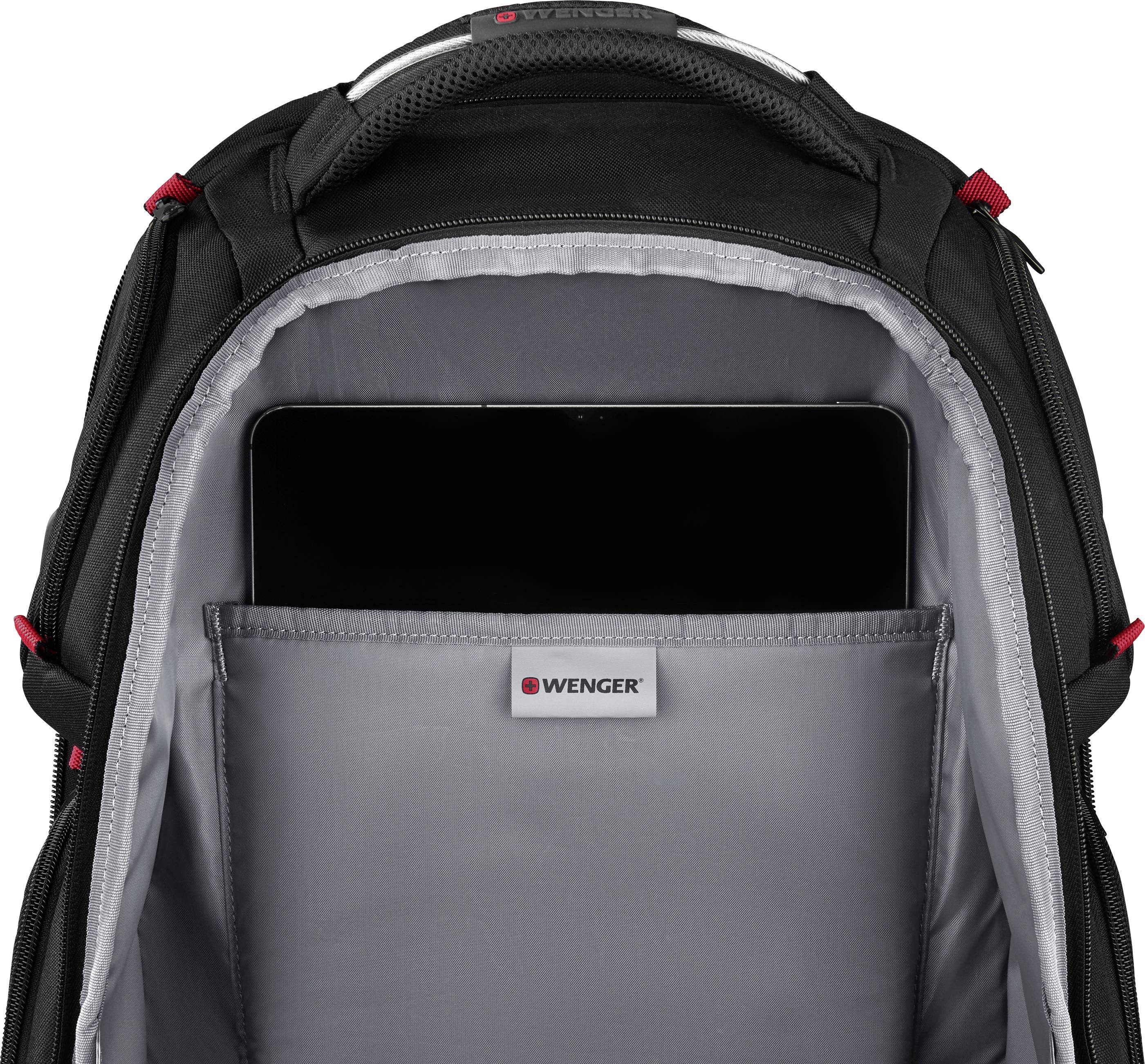 Otevřený batoh ukazuje prostor pro notebook s notebookem uvnitř. Vnitřní výstelka je šedá.
