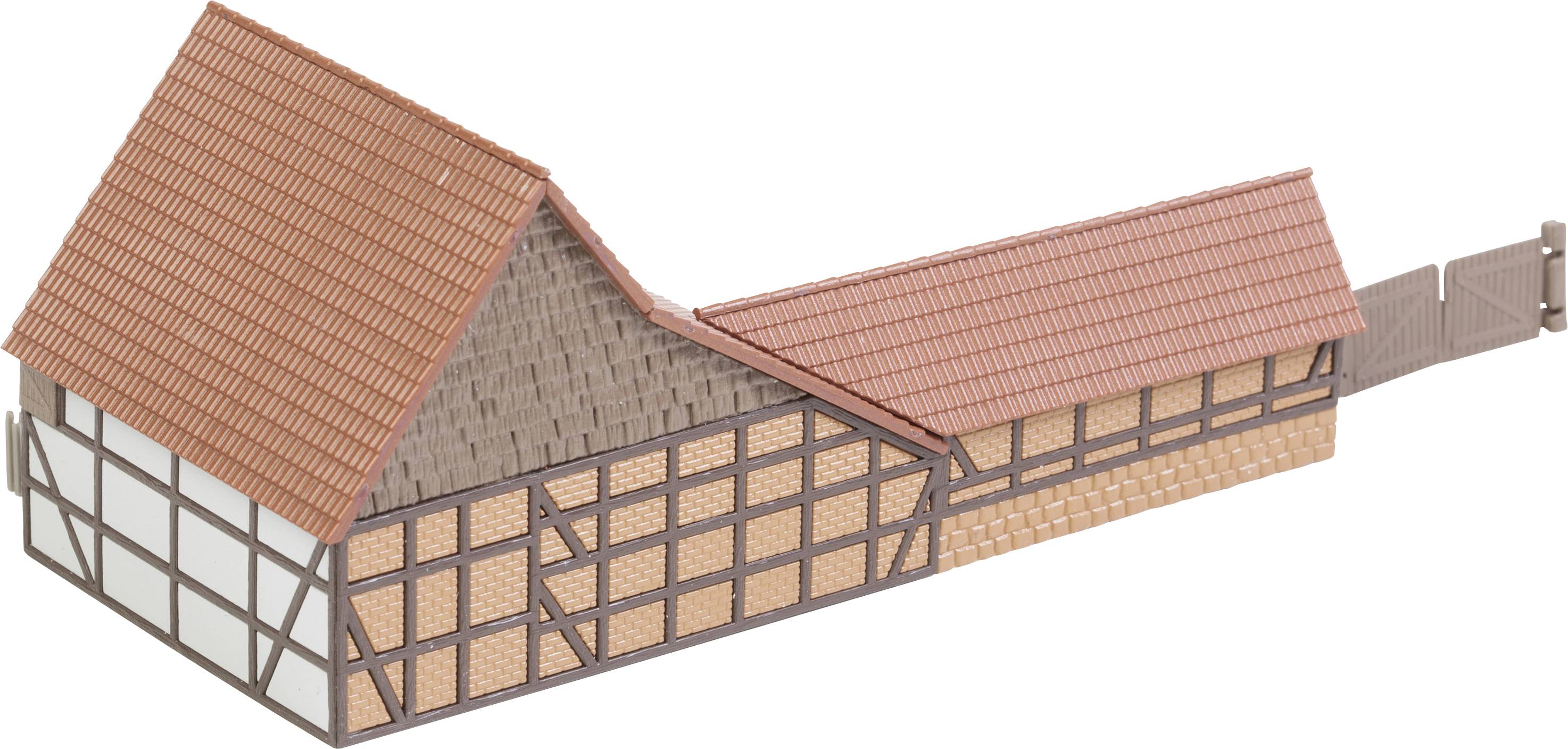 Model tradičního hrázděného domu s červenými střešními taškami a dřevěnou trámovou konstrukcí, typický evropský architektonický design.