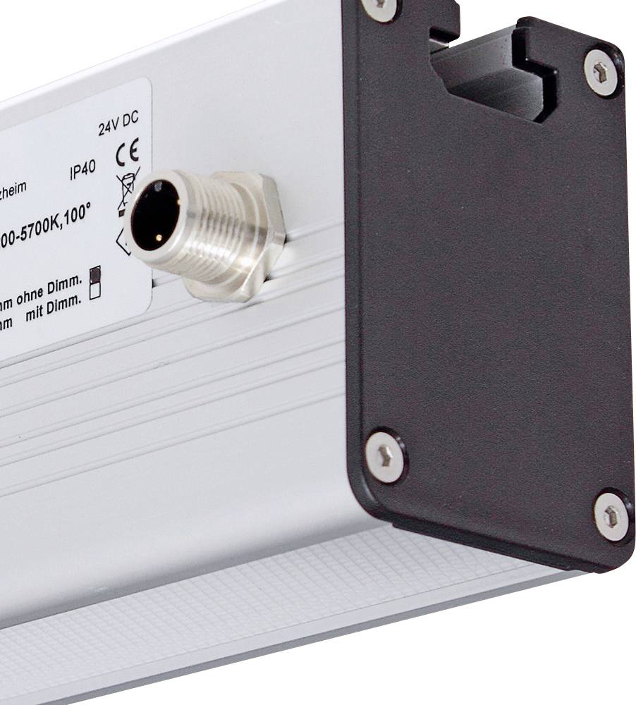 Obdélníkové elektrické zařízení s kovovým pouzdrem, bočním připojením a černým krytem. Štítek se specifikacemi jako 'IP40' a '24V DC'.