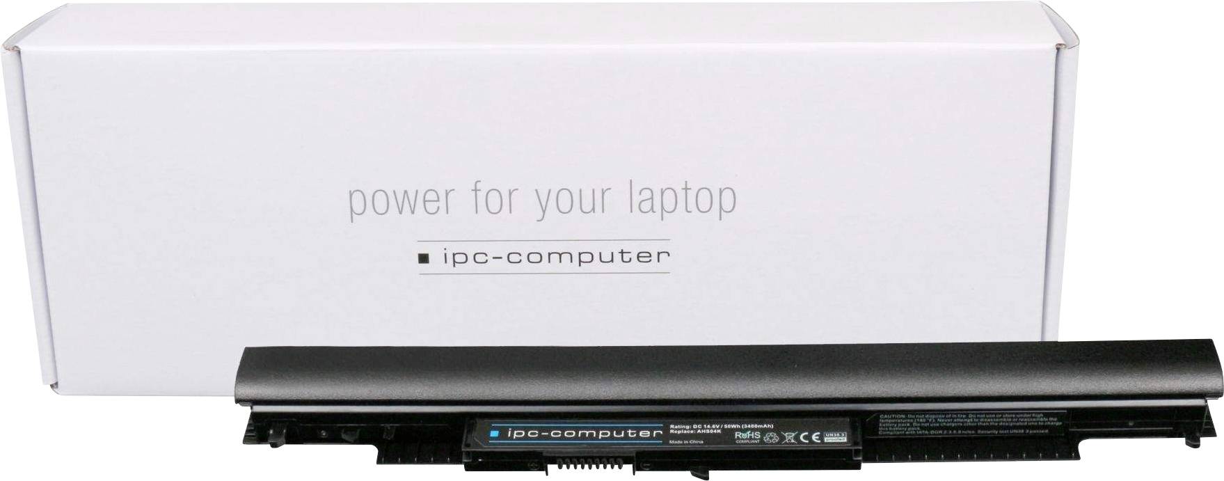 Notebook baterie a obal s nápisem 'power for your laptop' a 'ipc-computer'. Baterie a krabice jsou viditelné v popředí.