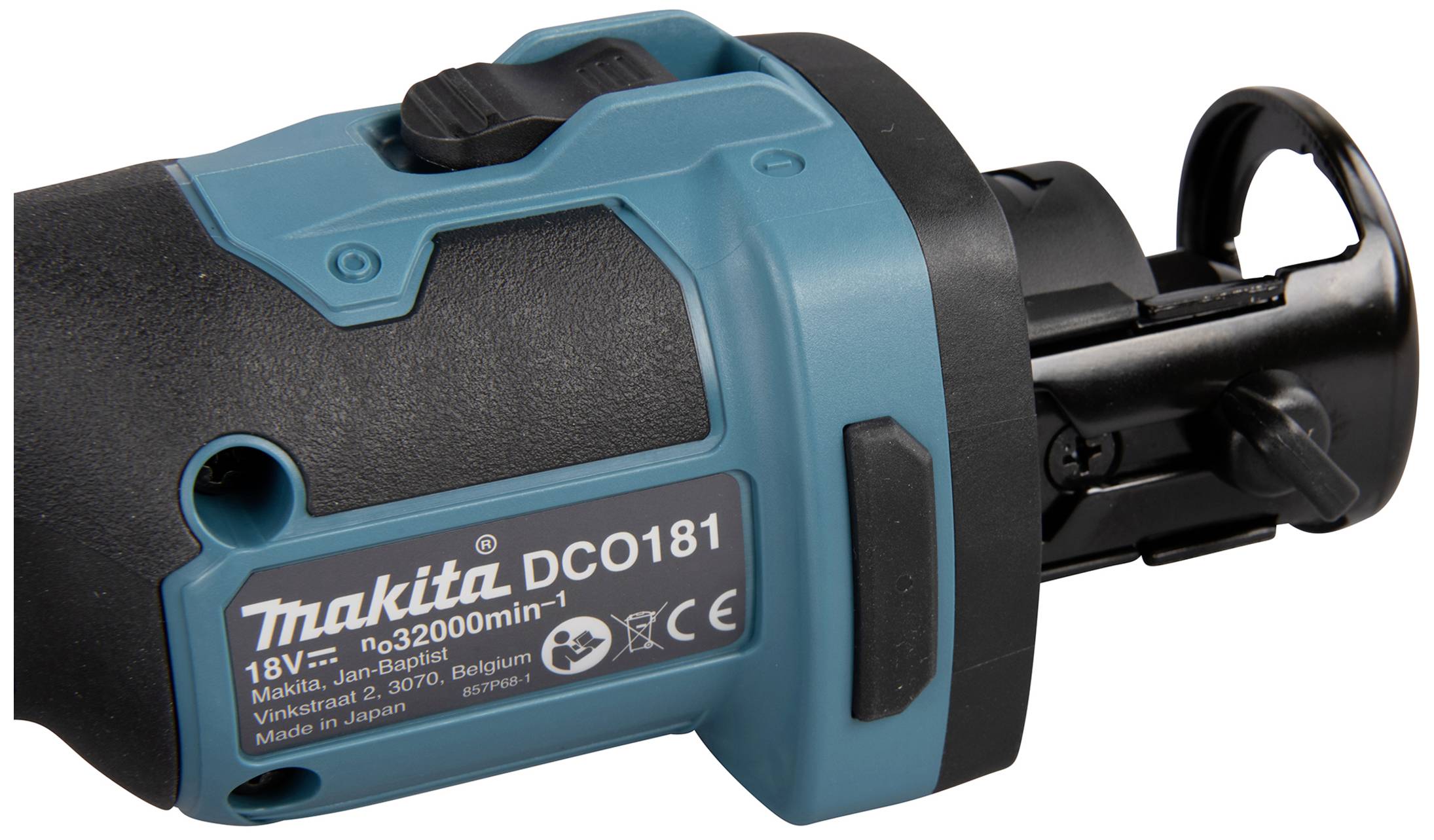 Modré a černé zařízení Makita s číslem modelu DCO181. Štítek zobrazuje technické detaily a místo původu.