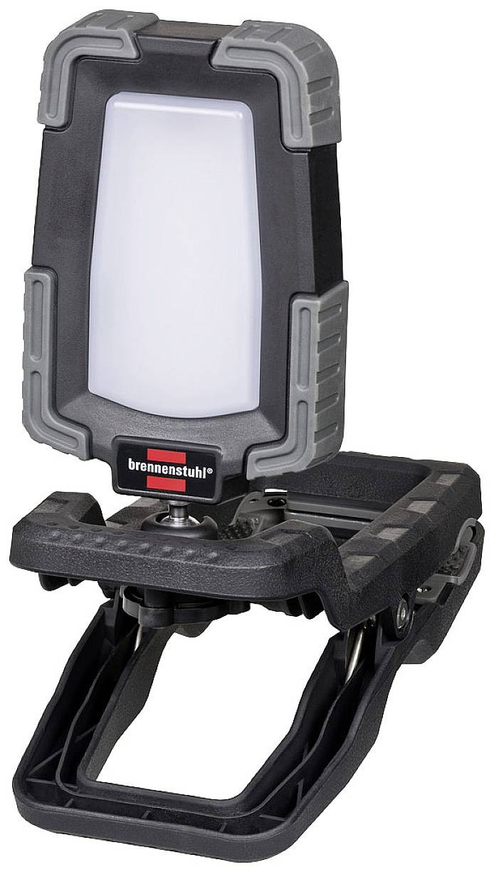 Přenosná LED pracovní svítilna s odolným pouzdrem, klipovou konzolí a bílým světelným panelem, vhodná pro použití v dílně i venku.