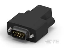Černý adaptér s konektorem VGA, který se používá pro připojení elektronických zařízení.
