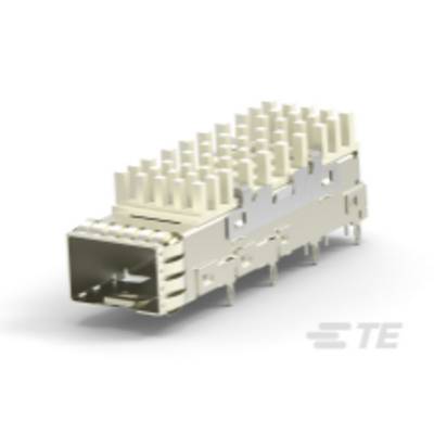 Stříbrný elektronický konektor obdélníkového tvaru s několika kontakty, ležící na světlém povrchu.