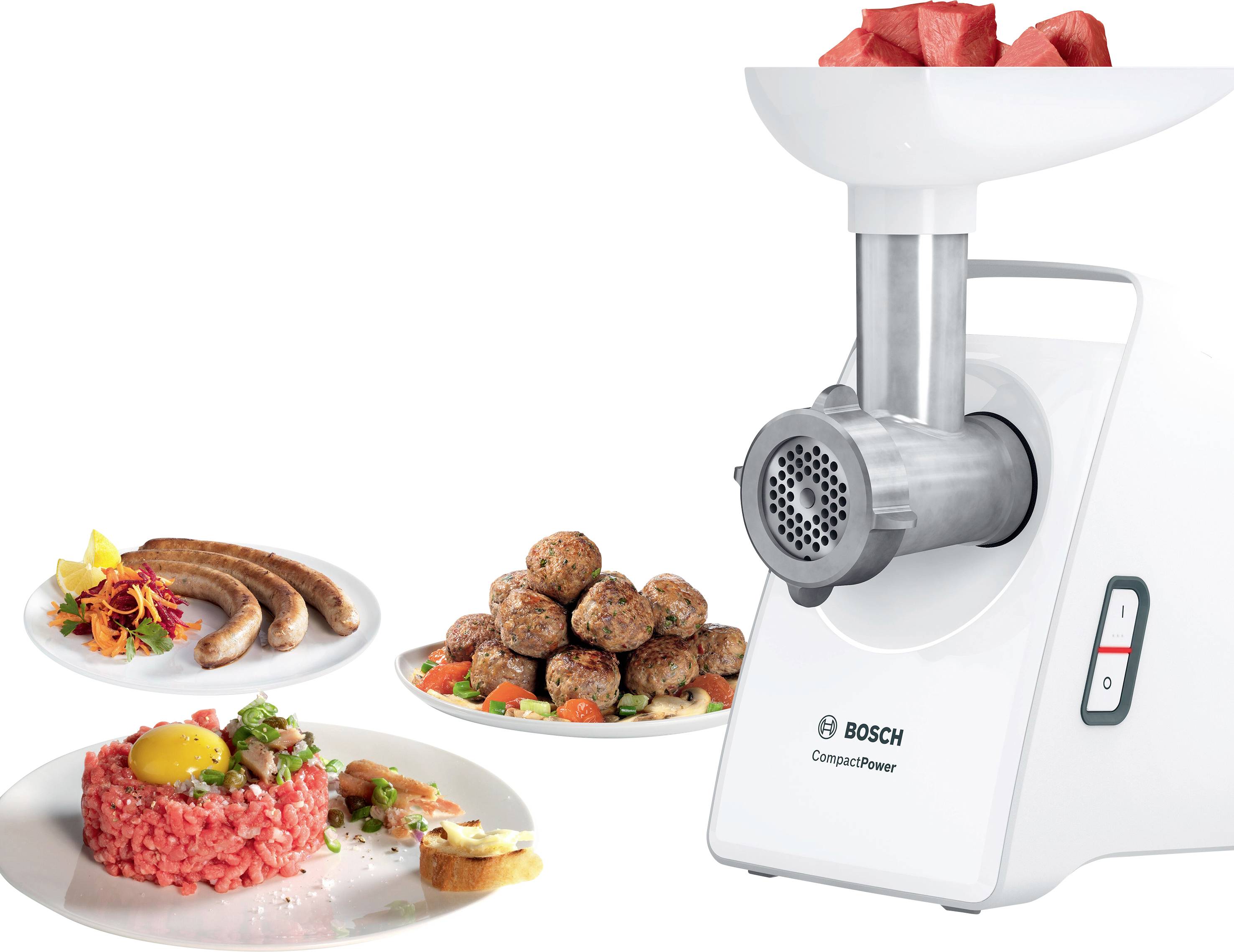 Mlýnek na maso značky Bosch s masem nahoře. Vedle talíř s mletým masem, karbanátky a párky jako hotovými výrobky.