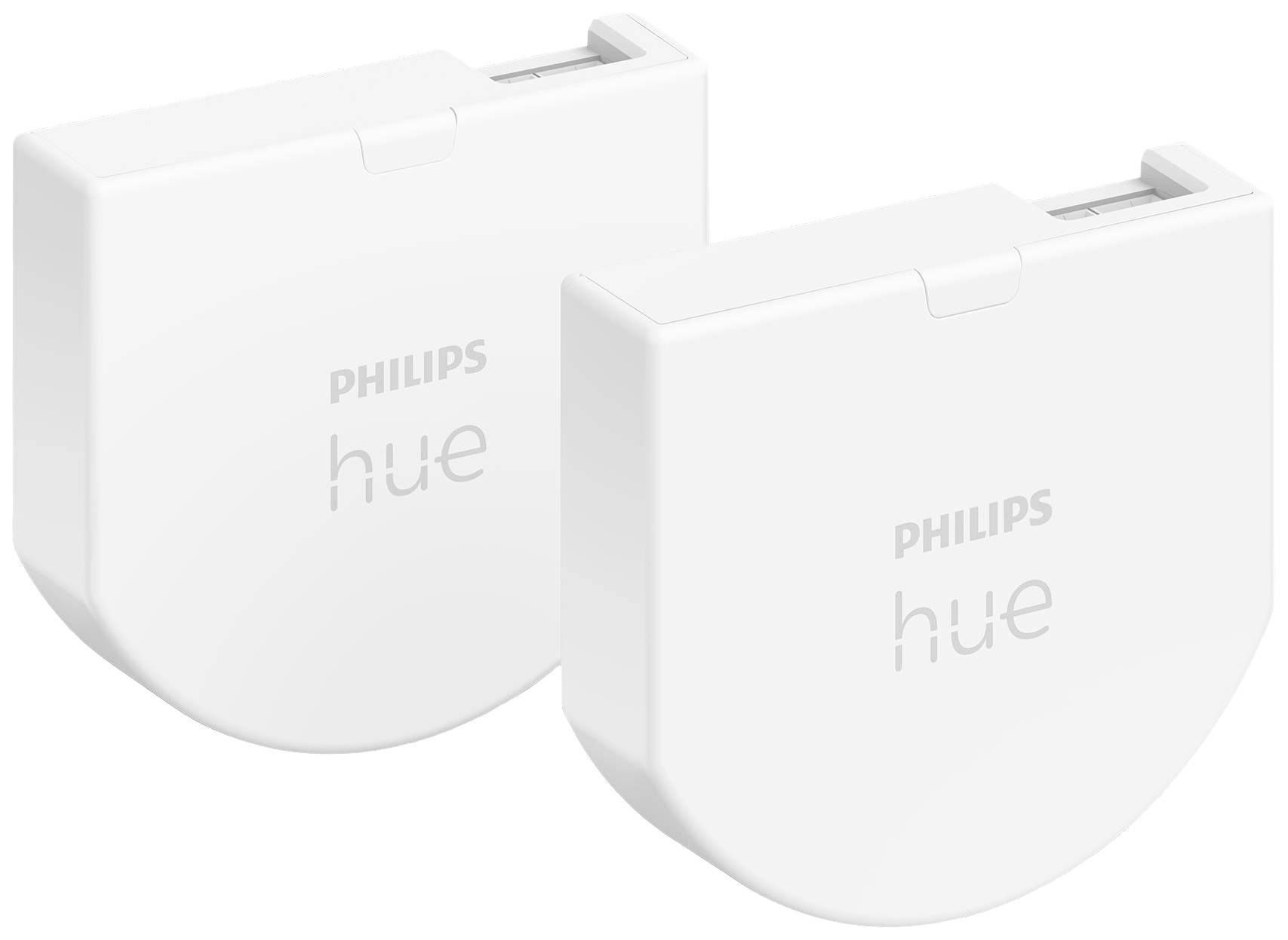 Dva bílé spínací moduly Philips Hue Smart vedle sebe. Umožňují ovládání osvětlení pomocí mobilní aplikace nebo hlasového příkazu.
