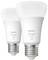 Dvě žárovky Philips Hue se závitovou paticí, model 'White 1100', zobrazené na světlém pozadí.