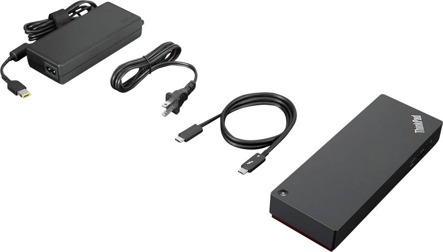 Černá nabíječka s napájecími kabely a černé elektronické zařízení vedle sebe na bílém pozadí.
