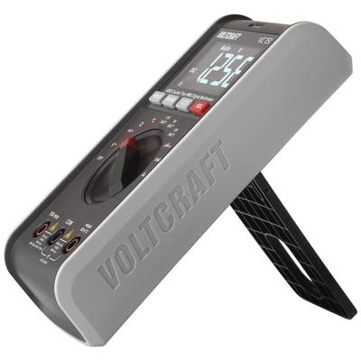 Digitální multimetr se stojánkem ukazuje napětí 12,56 voltů. Na přístroji je nápis 'VOLTCRAFT'.