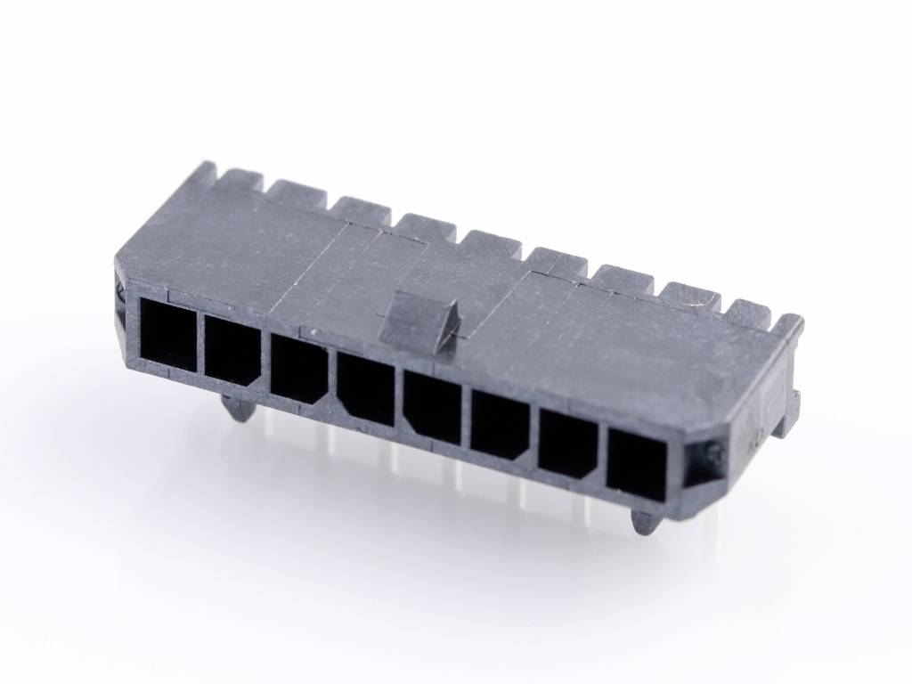 Černý, obdélníkový elektrický konektor s několika přípojnými zdířkami na bílém pozadí.
