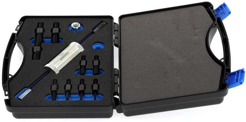 Sada na opravu důlků na karoserii v otevřeném černém kufříku s různými nástavci a příslušenstvím.