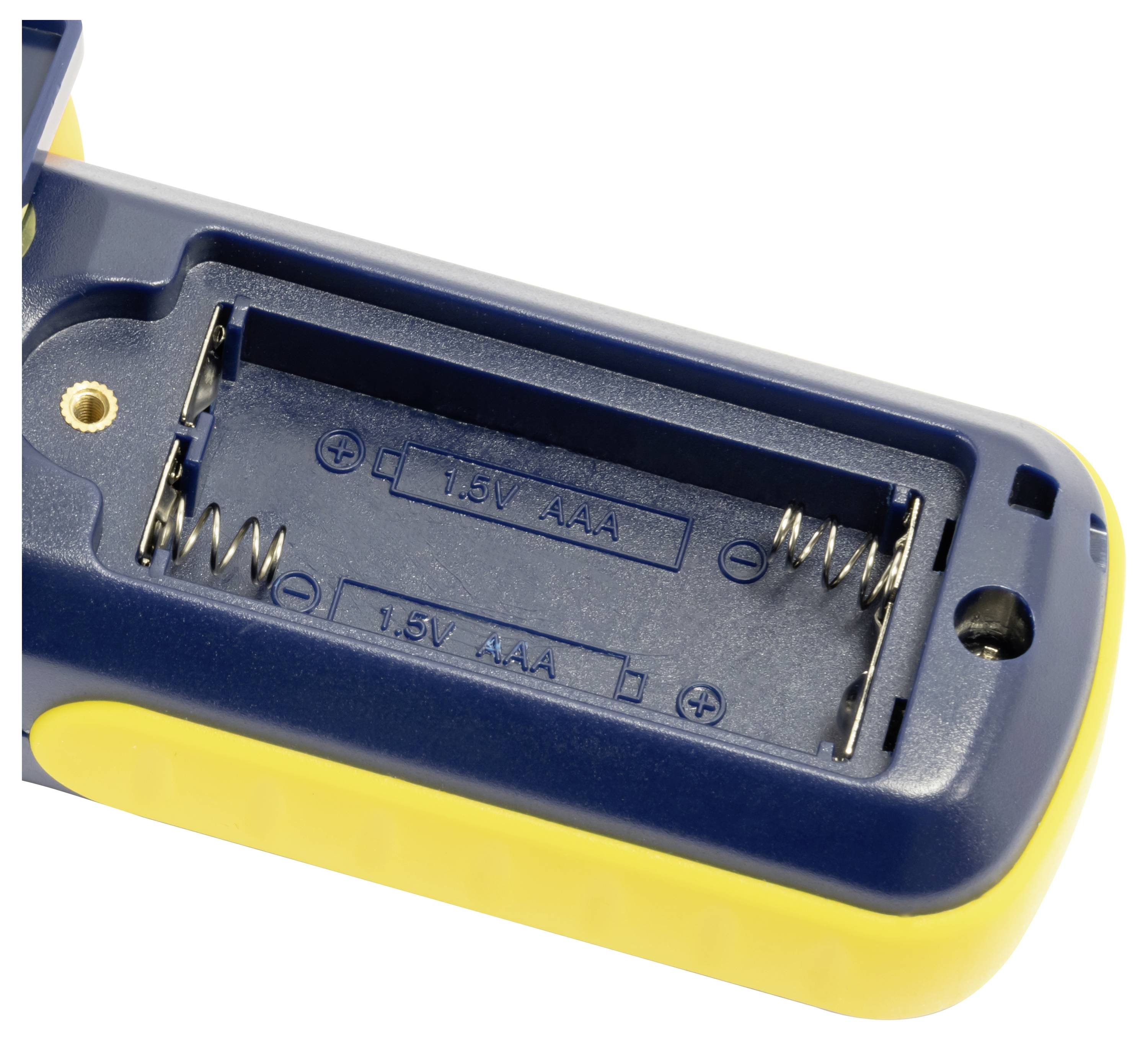 Detailní pohled na přihrádku baterie pro dvě baterie AAA 1,5V s označením kladné a záporné polarity uvnitř modro-žlutého zařízení.