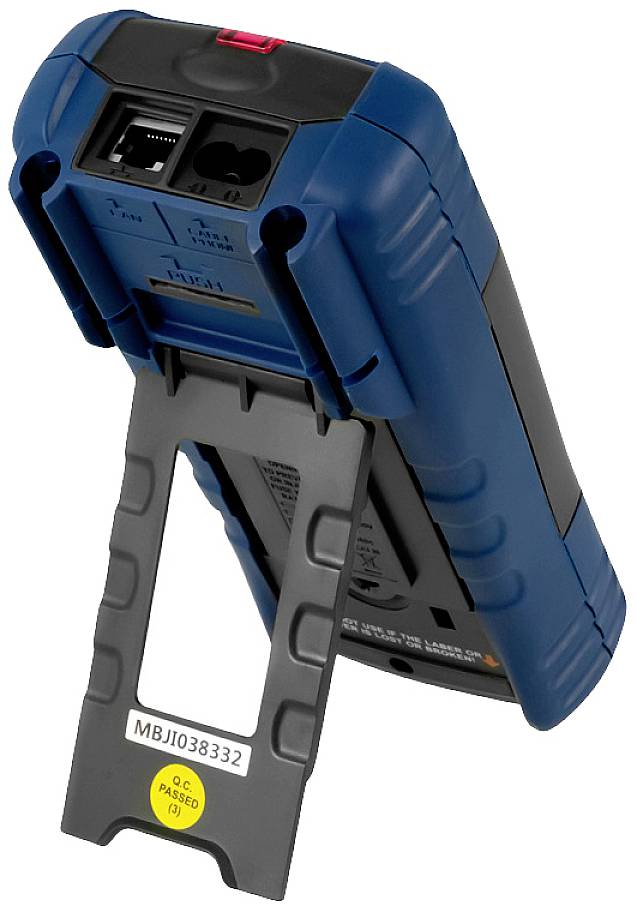 Modrý ruční tester se černým stojanem. Vypadá funkčně, pravděpodobně pro technické nebo průmyslové použití.