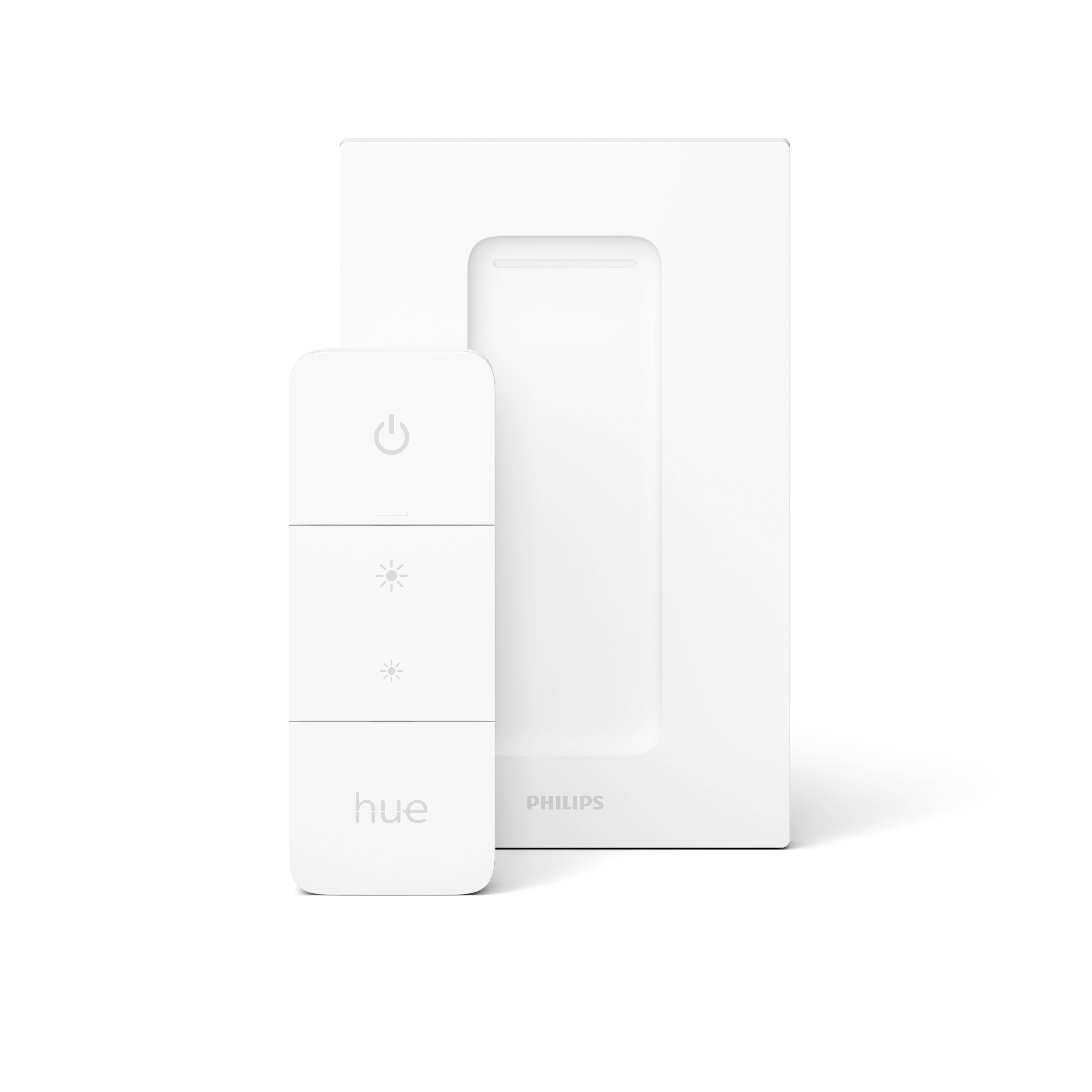 Bílý stmívač Philips Hue umístěný před bílým obdélníkovým krytem. Spínač má tři tlačítka pro ovládání a stmívání.
