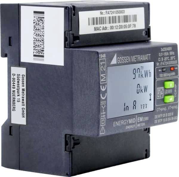 Digitální elektroměr ukazuje '9,97 kWh', '0 kW', 'v A'. Výrobce: Gossen Metrawatt GmbH, Norimberk. Model: ENERGYMID EM 2280.