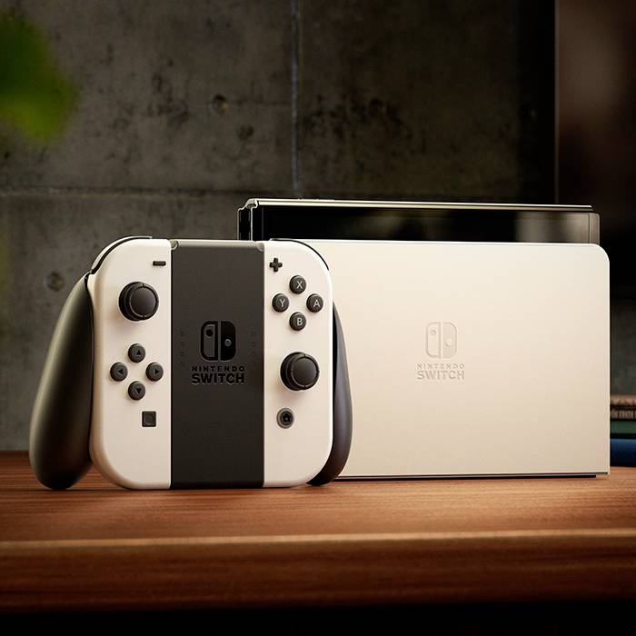 Herní konzole Nintendo Switch s odpojitelnými ovladači Joy-Con. V pozadí televizor, který konzoli doplňuje.