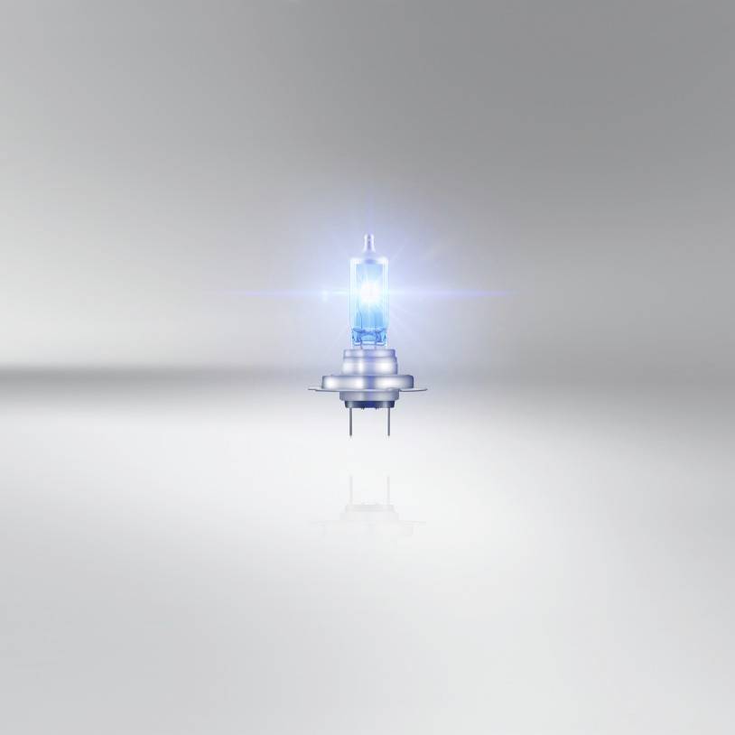 Zářivá žárovka vznášející se uprostřed šedého pozadí symbolizuje inovaci a energii.