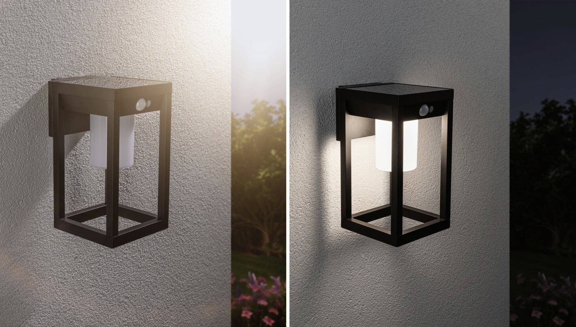 Nástěnná lampa v moderním, čtvercovém designu, rozsvěcující se za soumraku, namontovaná na venkovní stěně s zahradou v pozadí.
