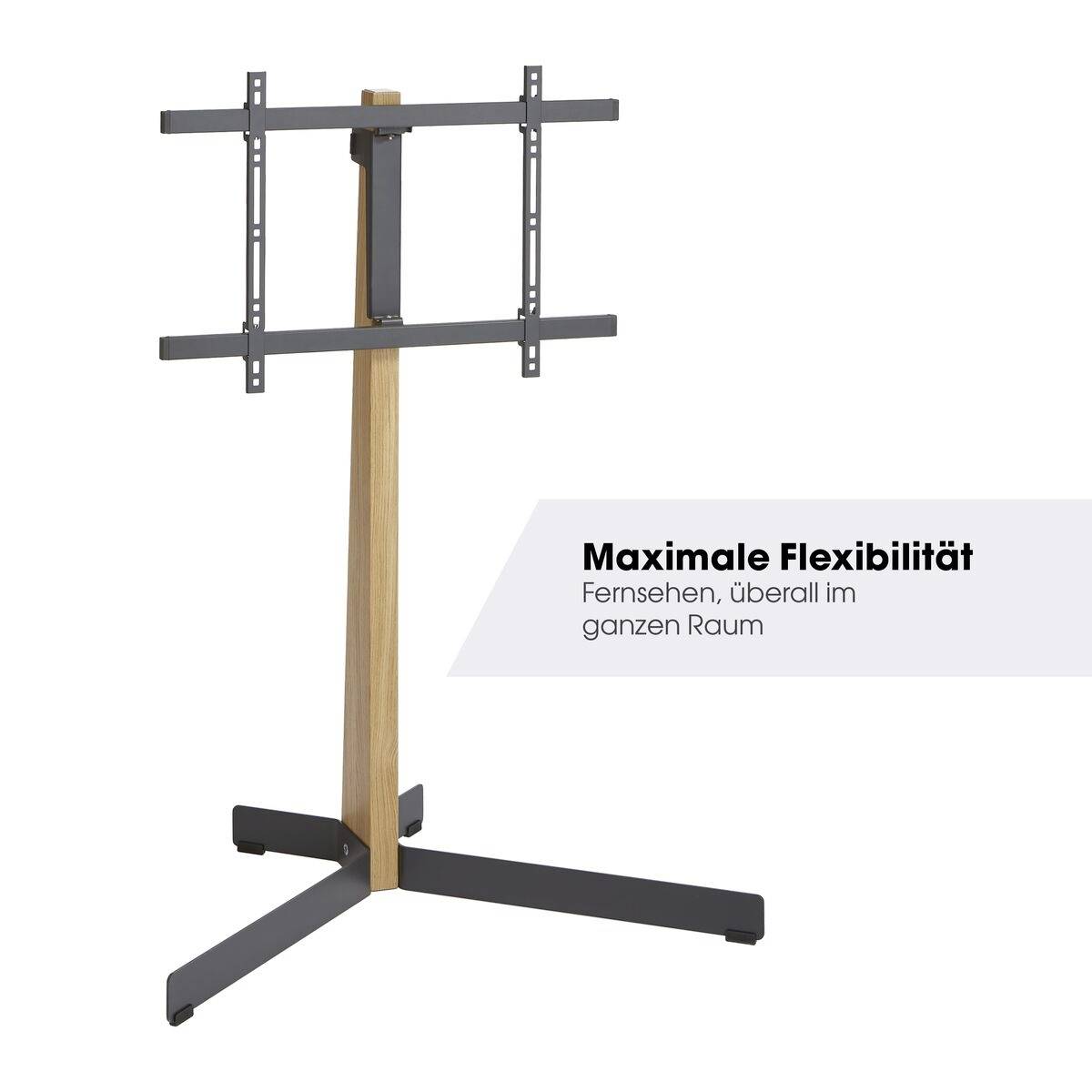 Dřevěný a kovový stojan na TV s minimalistickým designem. Text uvádí: 'Maximální flexibilita – sledování televize kdekoliv v prostoru'.