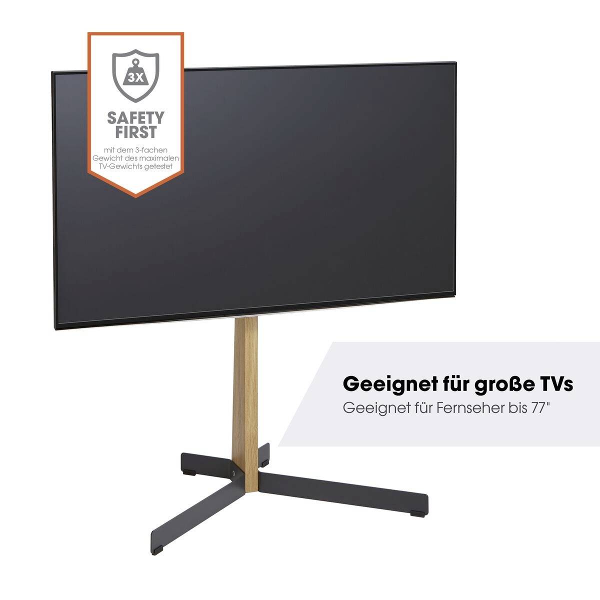 Stojan na TV s černou obrazovkou a křížovým podstavcem z dřeva a kovu. Text: 'Vhodné pro velké TV až do 77"' a 'Bezpečnost především'.
