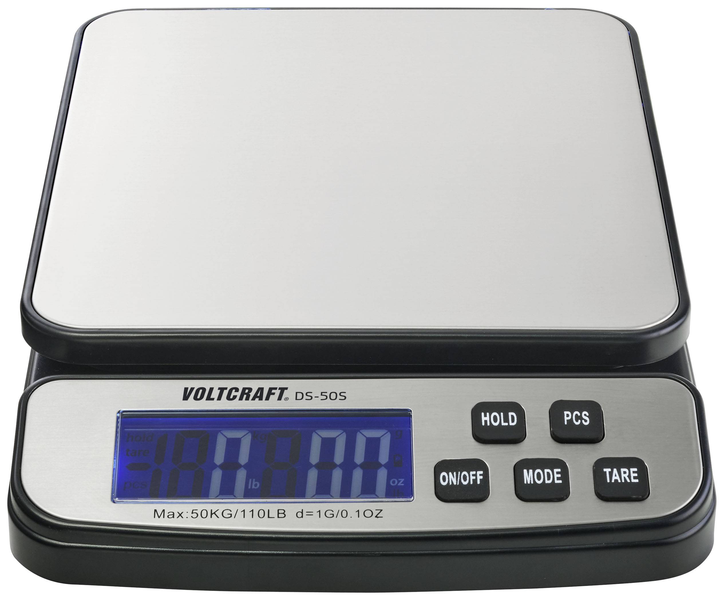 Elektronická stolní váha s digitálním displejem, značka 'Voltcraft', maximální kapacita 50 kg. Funkce: podržení, režim, tárování.