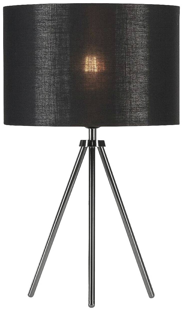 Černá stolní lampa se třínožkovým stojanem. Válcovitý stínidlo propouští teplé světlo.