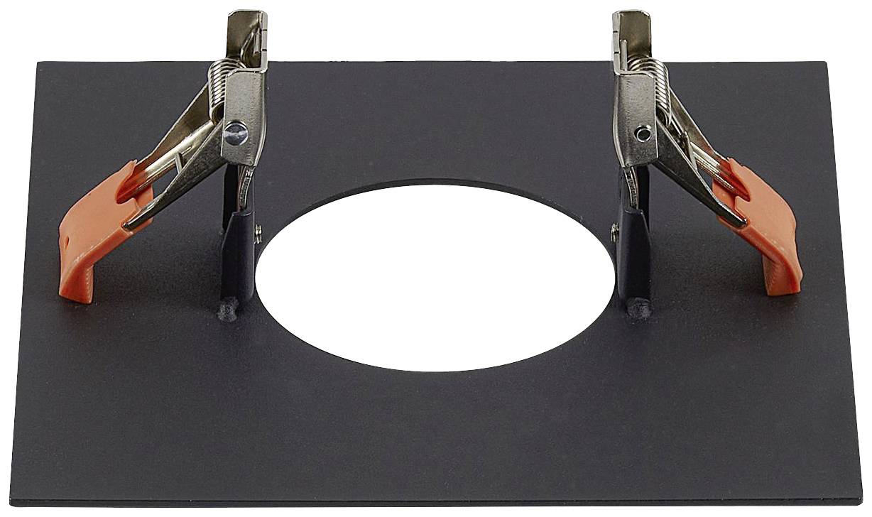 Kovové svorky s oranžovými gumovými úchyty na obdélníkovém černém plastovém rámu s kulatým otvorem uprostřed.