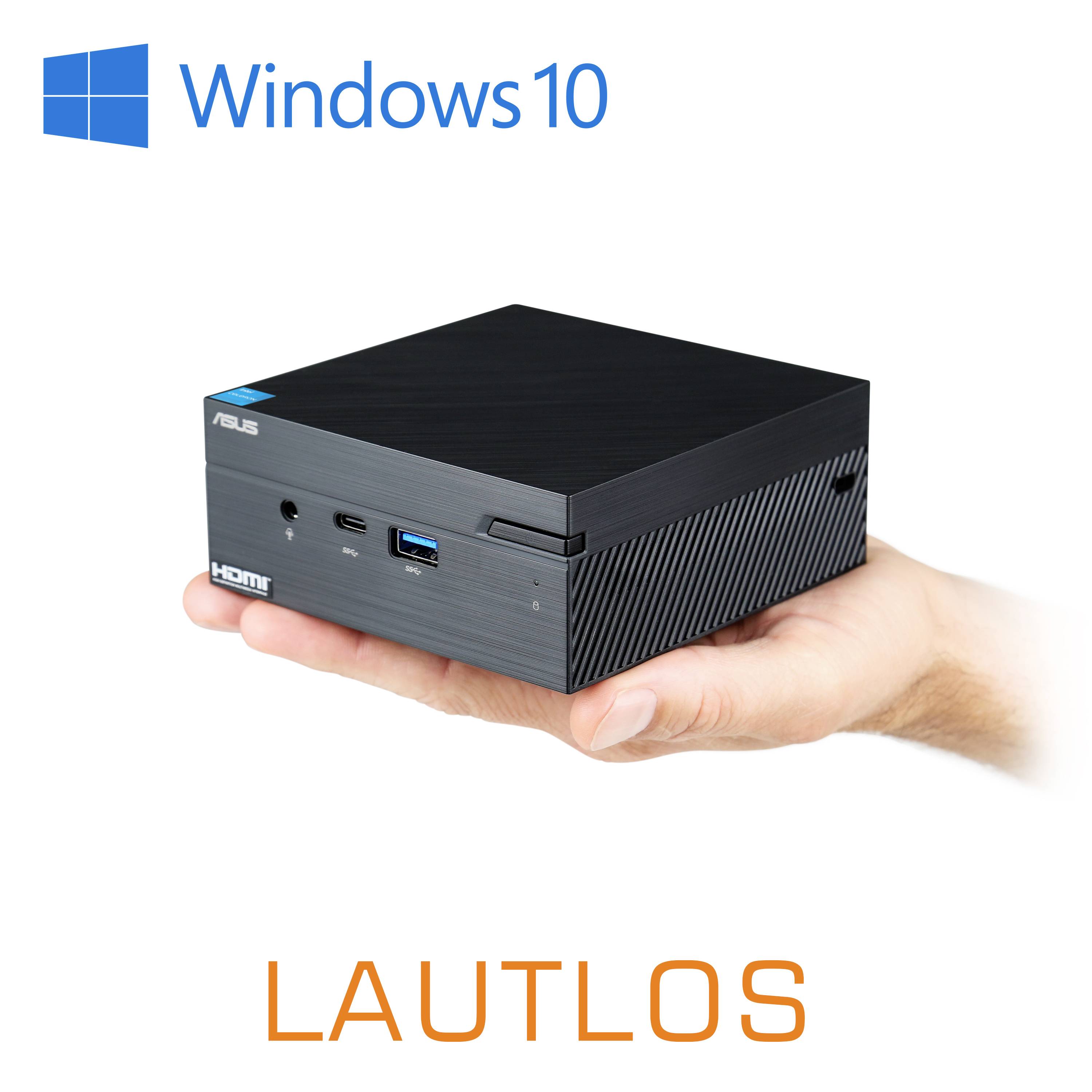 Jedna ruka drží černý mini počítač s logem Windows 10, označený jako tichý. Hlavní konektory jsou viditelné na přední straně.