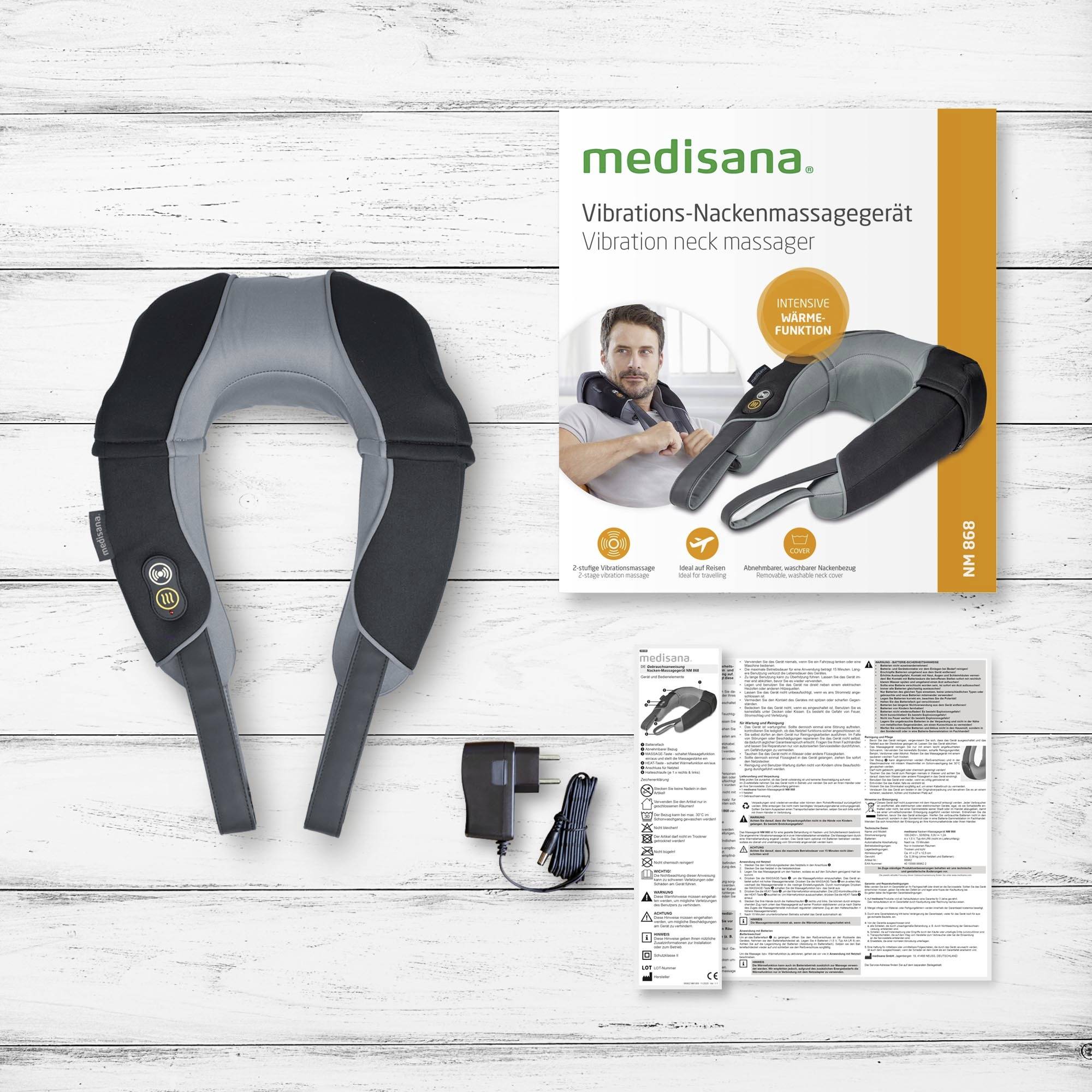 Medisana vibrační masážní přístroj na krk s dálkovým ovládáním. Obsahuje přístroj, adaptér, návod v několika jazycích. Vyobrazení produktu v obalu.