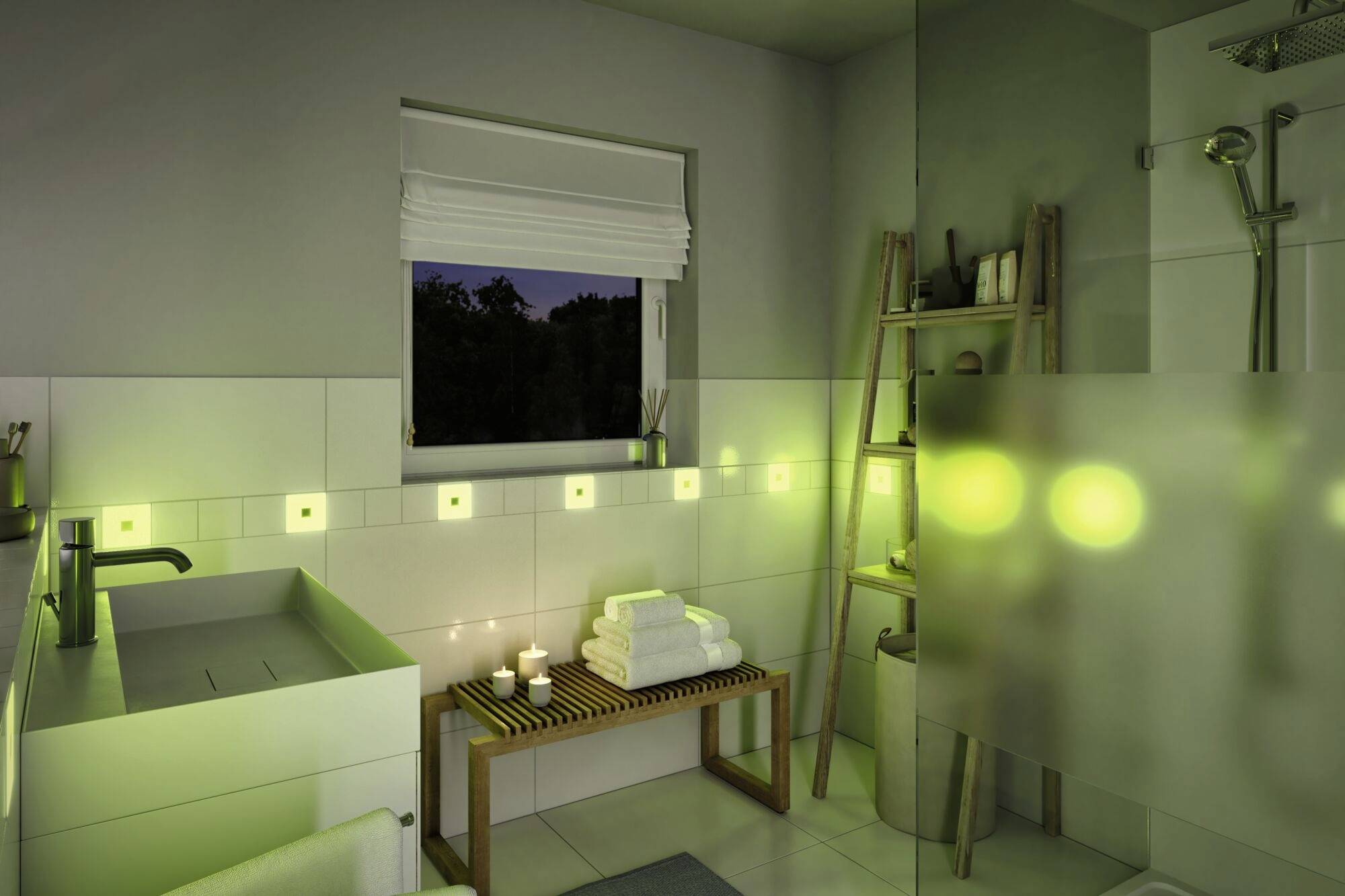 Moderní koupelna s atmosféricky zeleným osvětlením, rostlinami na polici, umyvadlem vlevo a sprchou vpravo.