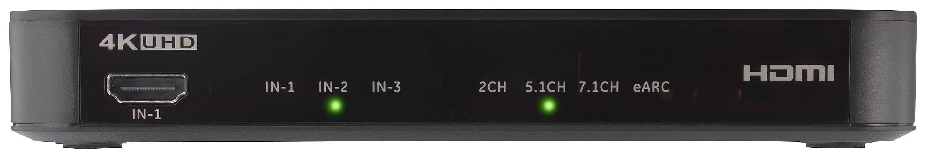 Černý AV přepínač s logem 4K UHD a HDMI. Zobrazuje vstupy: IN-1, IN-2, IN-3. Indikátory pro 2CH, 5.1CH, 7.1CH, QARC.