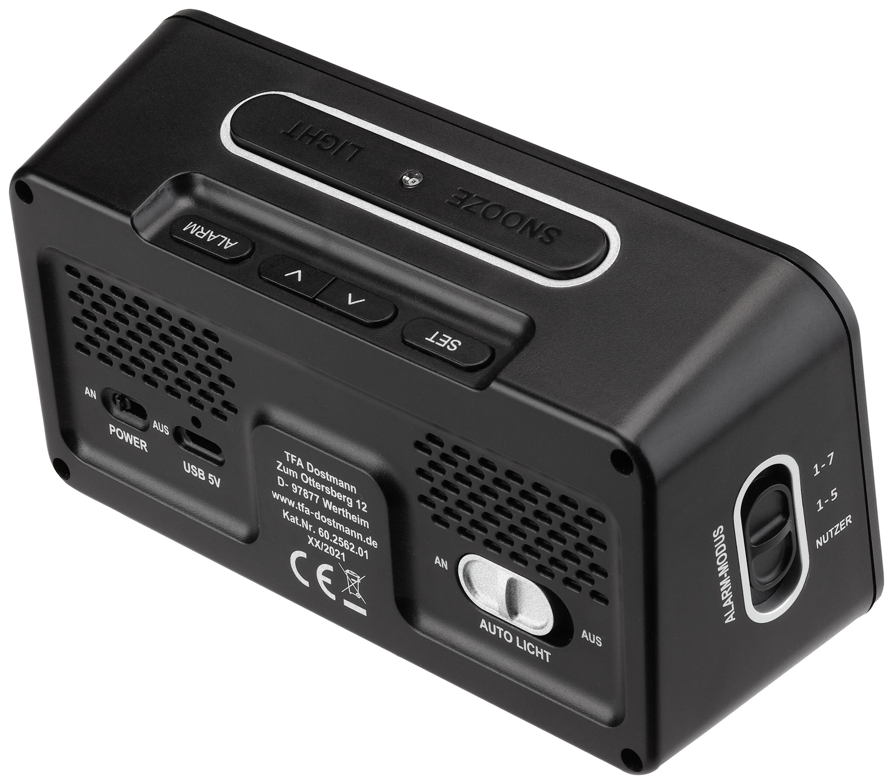 Černý digitální budík s tlačítky pro 'Odložení', 'Osvětlení', 'Nastavení' a 'Alarm'. USB port a reproduktor na zadní straně.