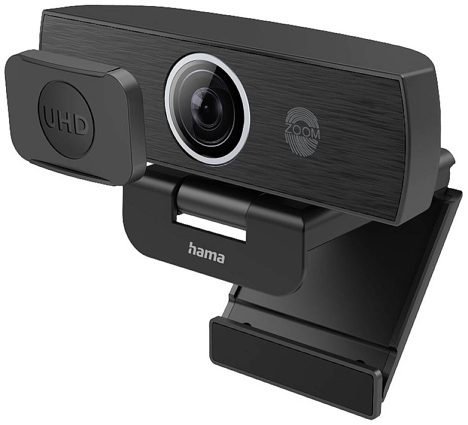 Webkamera s UHD rozlišením a funkcí zoom, připevněná k monitoru. Je černé barvy a má logo známého výrobce.