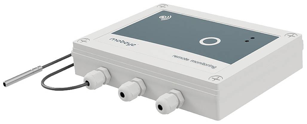 Bílé elektrické zařízení s displejem a několika přípojkami, používané pro dálkový monitoring nebo ovládání.