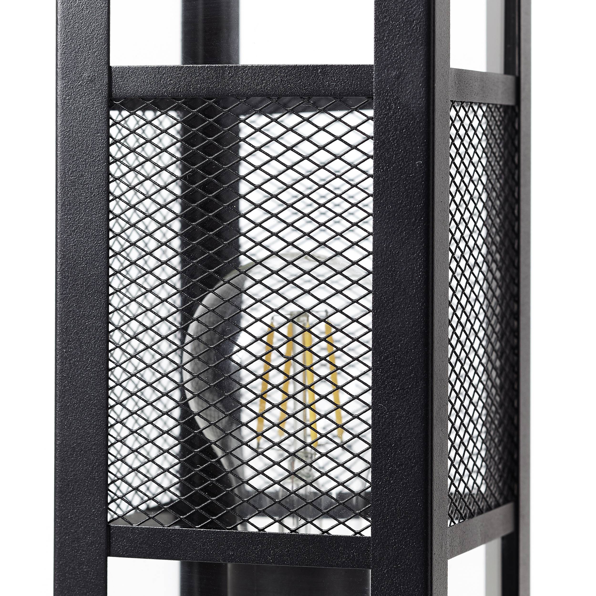 Kovová lampa se vzorovanou mřížkou odhaluje žárovky uvnitř. Černá struktura je moderní a geometricky navržená.